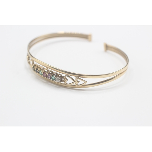 5 - 9ct gold 'DEAREST' torc bangle, gemstones including: diamond, emerald, amethyst ruby, sapphire & tou... 