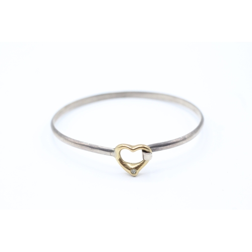 71 - 9ct gold & silver heart shape diamond bangle (9.2g)