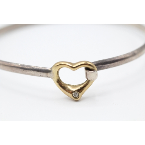 71 - 9ct gold & silver heart shape diamond bangle (9.2g)