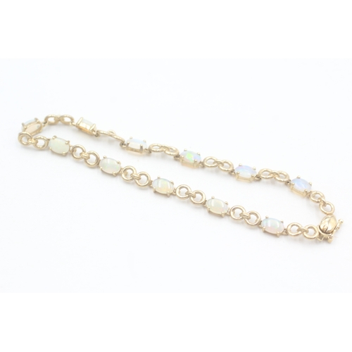 88 - 9ct gold opal bracelet (5.4g)