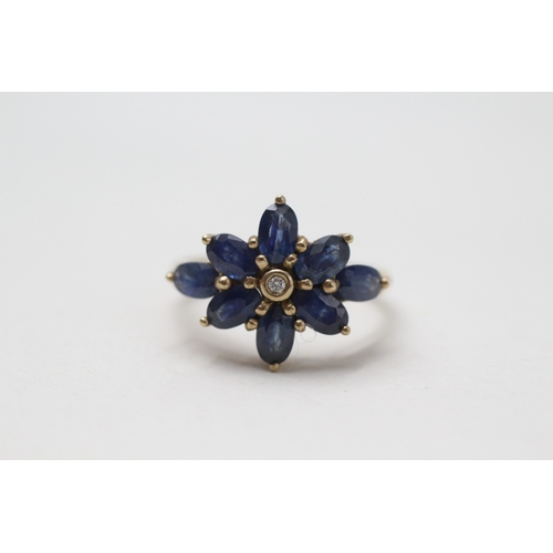 93 - 9ct gold diamond and sapphire flower cluster ring (3.1g) Size  N