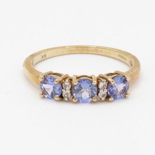 61 - 9ct gold tanzanite & white gemstone dress ring (2.2g) Size R