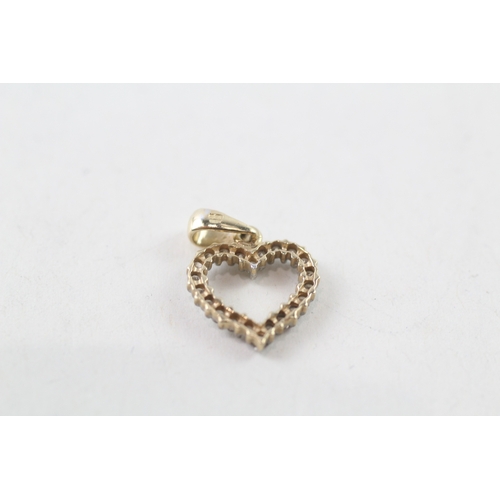 113 - 9ct gold diamond set open heart pendant (0.8g)