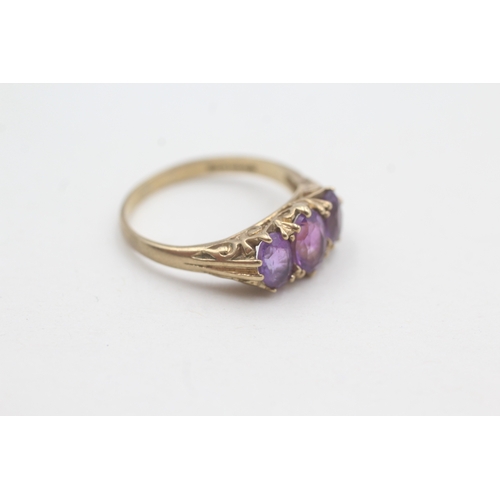 29 - 9ct gold three stone amethyst ring (2.6g)  Size O 1/2