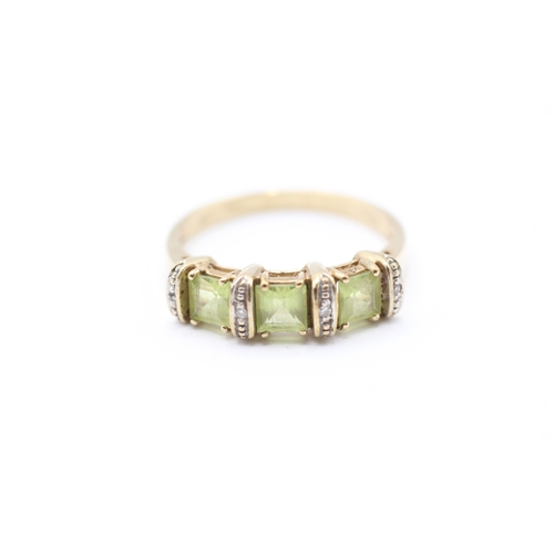 33 - 9ct gold diamond and peridot ring (2.8g) Size Q