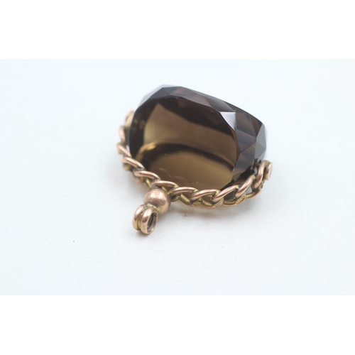 41 - 9ct gold vintage smokey quartz spinning fob (9.3g)