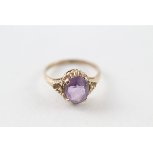 53 - 9ct gold purple stone ring (1.9g) Size L