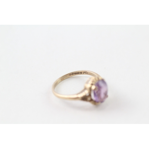 53 - 9ct gold purple stone ring (1.9g) Size L