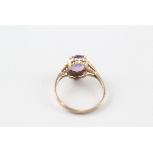 53 - 9ct gold purple stone ring (1.9g) Size L