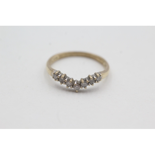 54 - 9ct gold seven diamond wishbone ring (1.5g) Size M