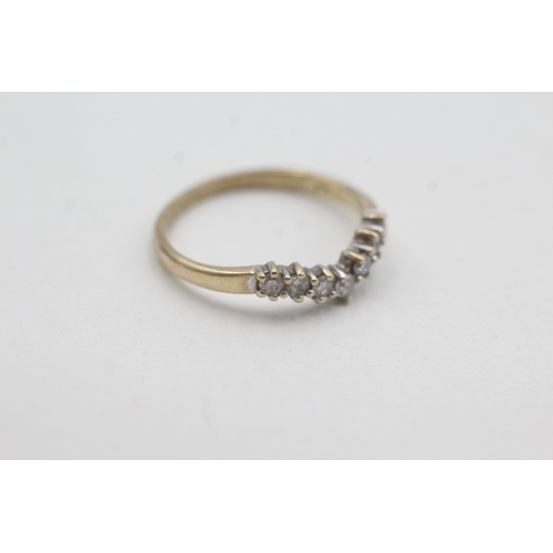 54 - 9ct gold seven diamond wishbone ring (1.5g) Size M