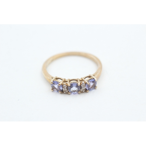 61 - 9ct gold tanzanite & white gemstone dress ring (2.2g) Size R