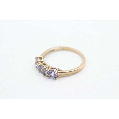 61 - 9ct gold tanzanite & white gemstone dress ring (2.2g) Size R