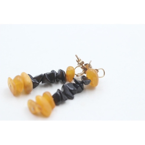 74 - 9ct gold black onyx & amber drop earrings (2.3g)