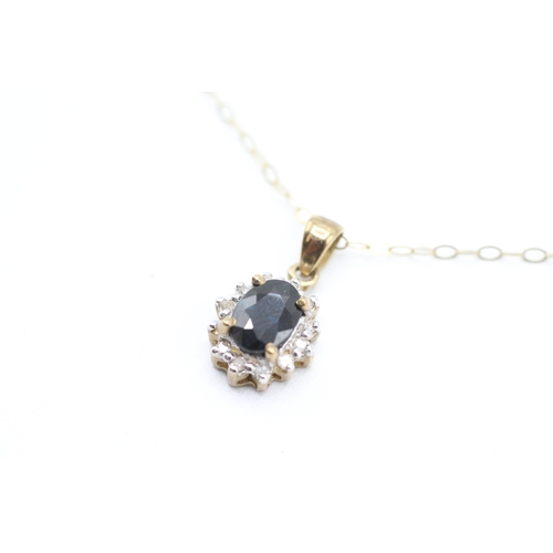 81 - 9ct gold diamond and sapphire halo pendant on chain (1.6g)