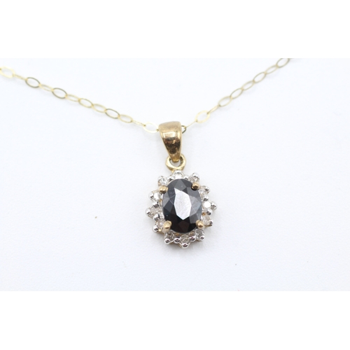 81 - 9ct gold diamond and sapphire halo pendant on chain (1.6g)