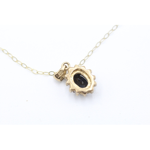 81 - 9ct gold diamond and sapphire halo pendant on chain (1.6g)