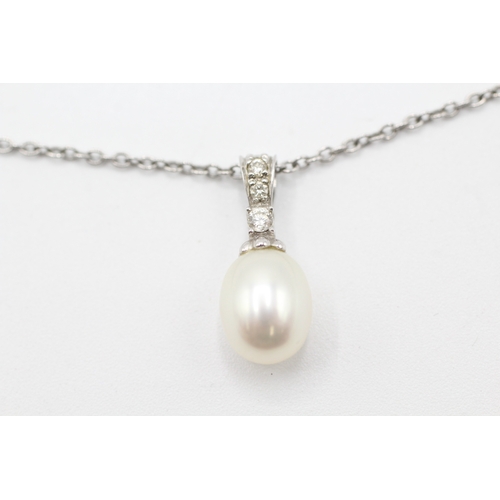 83 - 9ct gold diamond and cultured pearl pendant on chain (3.4g)