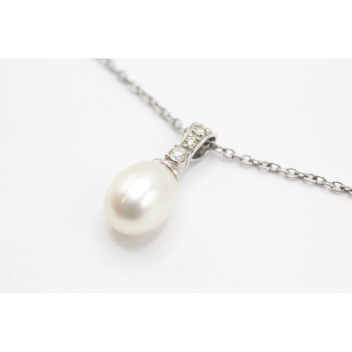 83 - 9ct gold diamond and cultured pearl pendant on chain (3.4g)