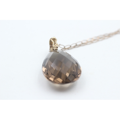 87 - 9ct gold faceted smokey quartz pendant necklace (7.6g)