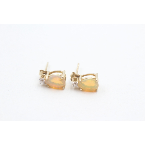 93 - 9ct gold opal & white gemstone stud earrings (1.4g)