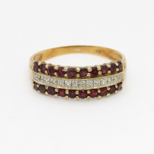 109 - 9ct gold diamond and garnet row ring (2.1g) Size  R