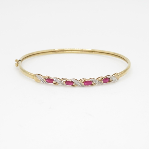 28 - 9ct gold ruby & diamond bangle (4.5g)