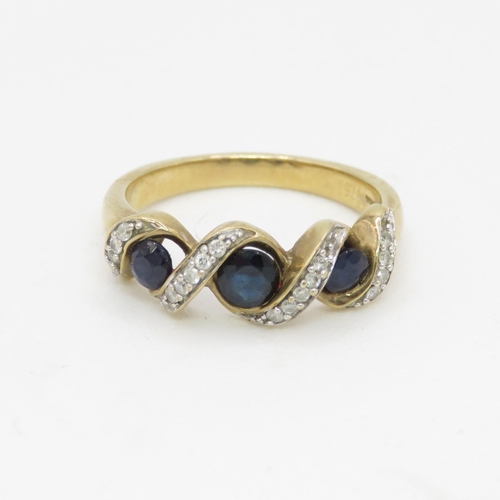 77 - 9ct gold diamond accented sapphire trilogy ring (3g) Size  J 1/2