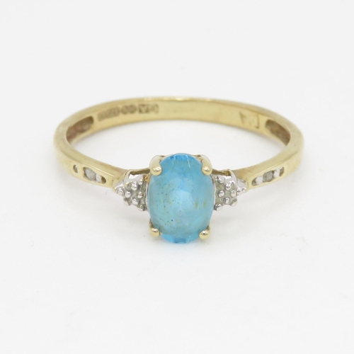 98 - 9ct gold oval cut blue topaz & diamond dress ring (1.2g) Size  N