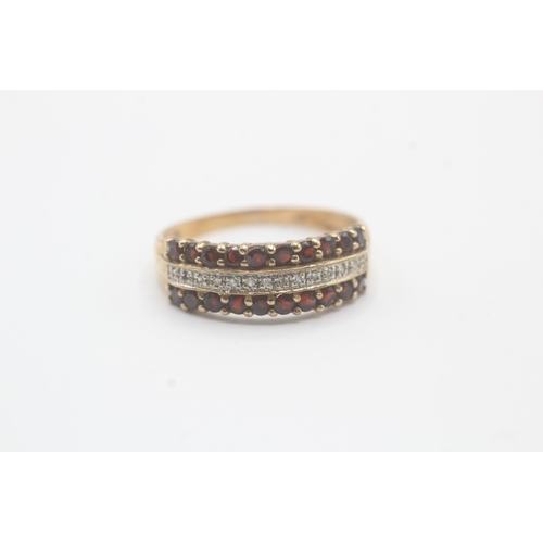 109 - 9ct gold diamond and garnet row ring (2.1g) Size  R