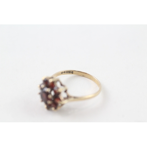 113 - 9ct gold garnet set cluster ring (2.2g) Size  N 1/2