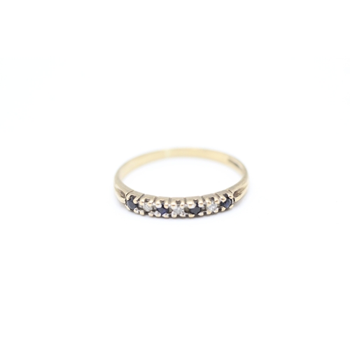 131 - 9ct gold diamond and sapphire ring (1g) Size  J