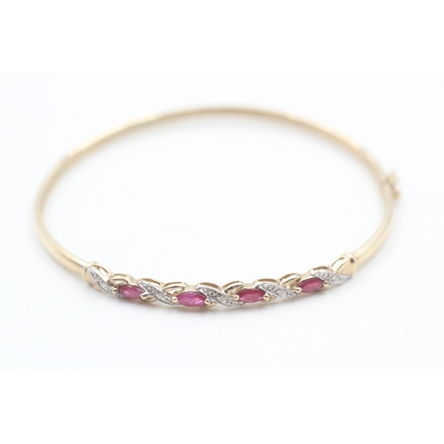 28 - 9ct gold ruby & diamond bangle (4.5g)