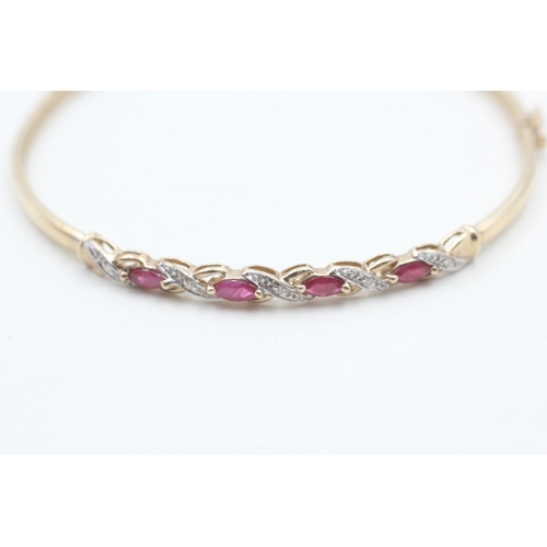 28 - 9ct gold ruby & diamond bangle (4.5g)