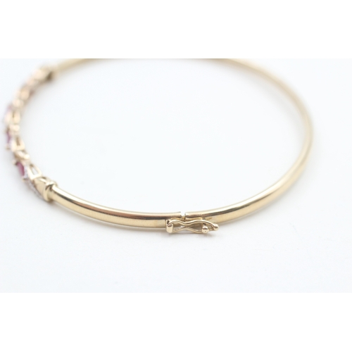 28 - 9ct gold ruby & diamond bangle (4.5g)