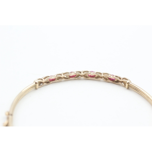 28 - 9ct gold ruby & diamond bangle (4.5g)