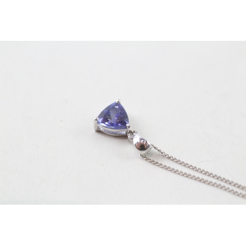 38 - 14ct white gold trilliant cut tanzanite set solitaire pendant necklace (1.4g)