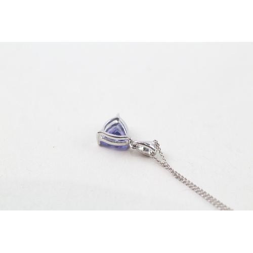 38 - 14ct white gold trilliant cut tanzanite set solitaire pendant necklace (1.4g)