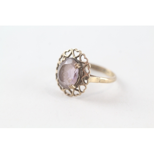 56 - 9ct gold amethyst set heart bordered cocktail ring (2.6g) Size  L