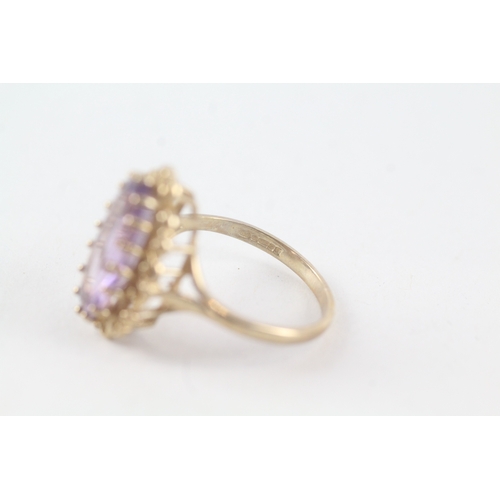 72 - 9ct gold amethyst set cocktail ring (3.2g) Size  M