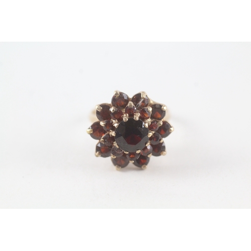 76 - 9ct gold garnet set cluster ring (5.3g) Size  P