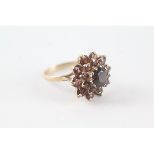 76 - 9ct gold garnet set cluster ring (5.3g) Size  P