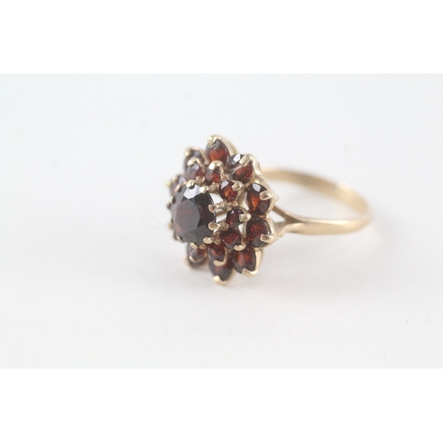 76 - 9ct gold garnet set cluster ring (5.3g) Size  P