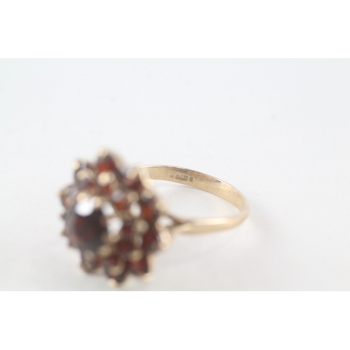 76 - 9ct gold garnet set cluster ring (5.3g) Size  P