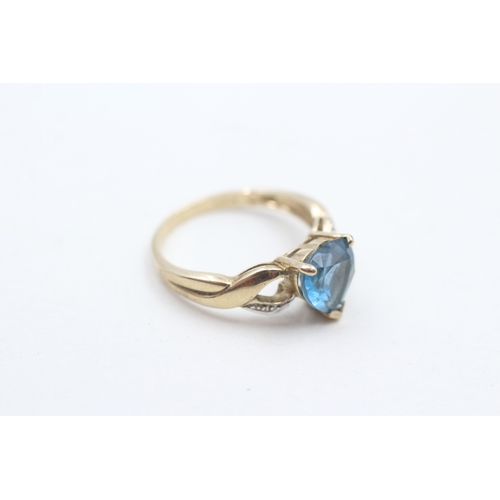 90 - 9ct gold heart shape blue topaz & diamond dress ring (2.7g) Size  N 1/2