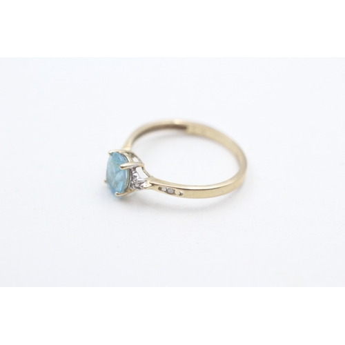 98 - 9ct gold oval cut blue topaz & diamond dress ring (1.2g) Size  N