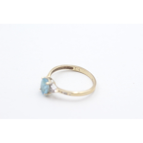 98 - 9ct gold oval cut blue topaz & diamond dress ring (1.2g) Size  N