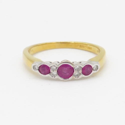 104 - 18ct gold diamond & ruby nine stone ring (2.9g) Size L