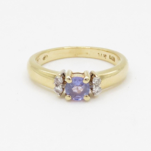 109 - 14ct gold tanzanite & diamond dress ring (2.1g) Size H