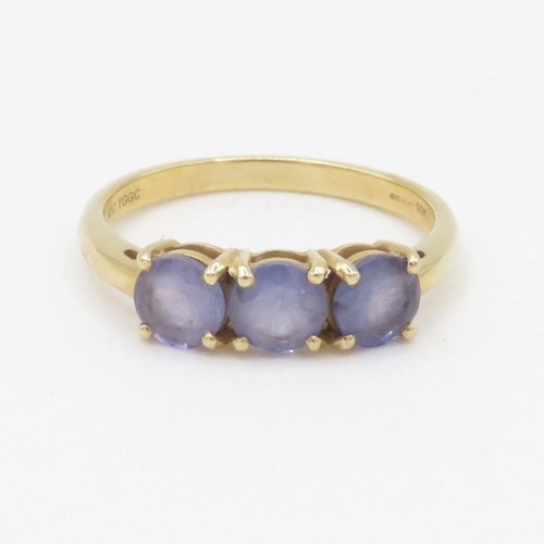 120 - 9ct gold three stone tanzanite ring (2.2g) Size P